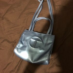 Light blue metallic silver telfar global bag